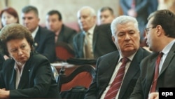 Following former President Vladimir Voronin's (center) election as speaker, former Prime Minister Zinaida Greceanii (left) is the leading candidate for president.