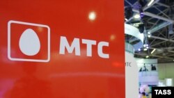 The logo of MTS, Russia's largest mobile operator, is seen at a telecoms exhibition in Moscow.