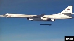 A Russian Tupolev Tu-160 long-range bomber releases a cruise missile at an unknown location in Syria in 2015.