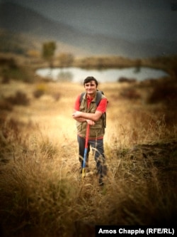 Sevak Arevshatian with his hiking pole wrapped in the colors of the Armenian flag.