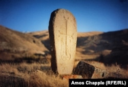 A khachkar featuring a winged cross on a remote plateau in Vayots Dzor Province. The khachkar was carved around 800 years ago.