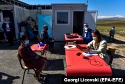 Officials conduct a census for homeless families in the village of Vizbegovo near Skopje on March 3. North Macedonia began a census of its diaspora, prisoners, the army, and the homeless one month before the official census was due to begin on April 1. It has now been postponed until September.