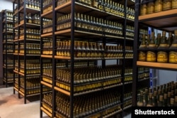 Bottles of Armenian brandy labelled “Cognac” in Cyrillic sit in storage in Yerevan.