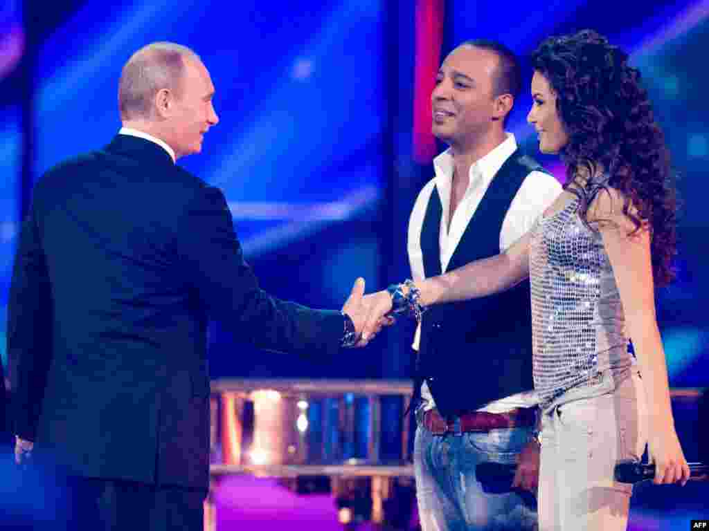 Russian President Vladimir Putin was seen as closely supervising Moscow&#39;s lavish preparations to host the competition in 2009. One analyst remarked that Putin saw Eurovision as a chance to promote &quot;national dignity.&quot; Here, the president meets Azerbaijan&#39;s contenders, Arash (center) and AySel (right).&nbsp;