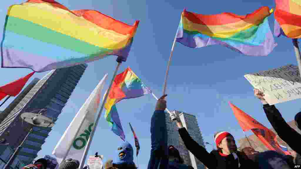 Gay-rights activists take part in a rally against homophobic laws in the central Arbat area in Moscow on March 10, 2012.