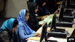 Election workers count votes at the Independent Election Commission headquarters in Kabul.