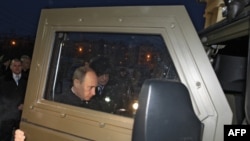 Russian Prime Minister Vladimir Putin inspects a Tiger armored military jeep near Sverdlovsk in December 2008.