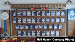 A wall of photos at Taghavard's school showing local fighters killed in the first Nagorno-Karabakh War (1988-94).