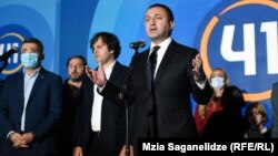 Prime Minister Irakli Gharibashvili celebrates after the polls close at a Georgian Dream rally in Tbilisi on October 2.