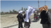 FILE: Taliban fighters in Ghazni during a brief ceasefire in May 2019.