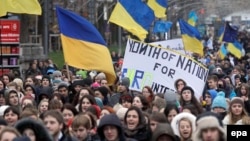 Students from different educational institutions shout slogans during their march in Kyiv on November 26.