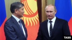 Russian Prime Minister and President-elect Vladimir Putin (right) with Kyrgyz President Almazbek Atambaev (file photo)