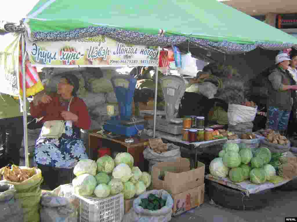 An open-air market in the Mongolian capital, Ulan Bator. - Mongolians are dedicated meat-and-dairy eaters, but occasionally let a few vegetables onto their plate. Many of the vegetables sold at markets are imported from China, although some are locally grown. A kilo of potatoes can sell for 700 tugrik, or 50 U.S. cents.