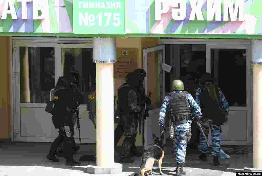 FSB and special rapid-response officers with a service dog enter School No. 175.