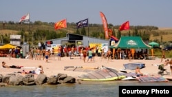 Anton Yevsyushkin boasts of the attractions of Mariupol, such as this windsurfing center.