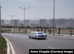 A limo glides back towards central Ashgabat after a marriage ceremony at the palace.