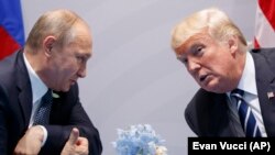 U.S. President Donald Trump (right) and Russian President Vladimir Putin at the Group of 20 summit in Hamburg last year.