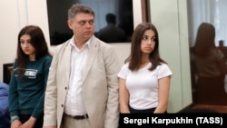 Maria (left) and Angelina Khachaturyan, sisters who admitted killing their father, are shown in court in June.