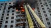 Firefighters work at the site of a Russian air strike in Kharkiv on September 15.