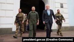 Ukrainian President Volodymyr Zelenskiy (left) and British Prime Minister Boris Johnson during a visit to St. Michael's Golden-Domed Monastery in Kyiv on June 17.