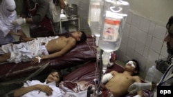 Students injured in the attack receive medical treatment at a local hospital in Peshawar.