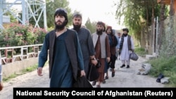 Newly freed Taliban prisoners leave a Kabul prison. The son of the late Taliban spiritual leader Mullah Mohammad Omar has been described as a relative moderate who favors a negotiated end to the war.