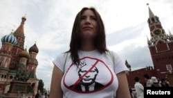 An opposition supporter defends the right of assembly on Red Square as part of a campaign protesting Vladimir Putin's presidency on May 27.