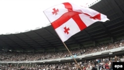 The opposition rally at the National Stadium in Tbilisi drew 55,000.