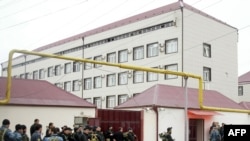 Special forces stand outside the parliament building in Grozny. At least six people were killed in the militant attack.