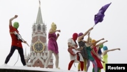 Members of the feminist punk rock group Pussy Riot performing an unsanctioned concert on Red Square