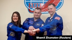 International Space Station crew members from the United States and Russia at the Baikonur cosmodrome in Kazakhstan in March 2019