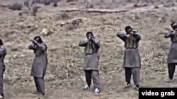 Tajik militants appear in a video purportedly training in Pakistan, where Jamaat Ansarullah was founded in 2006 by former members of the Islamic Movement of Uzbekistan (IMU).