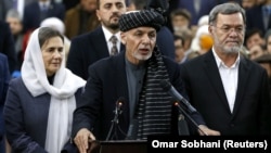 Afghan President Ashraf Ghani (center) is up against warlords, former communists, and mujahedin.