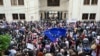 Demonstrators protesting the "foreign agent" law crowd outside the parliament building in central Tbilisi on May 28.