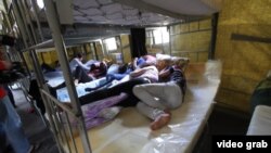 Suspected illegal migrant laborers inside a detention camp in Moscow on August 6.