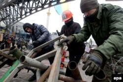 "Euromaidan" protesters set up a barricade in downtown Kyiv on December 13.