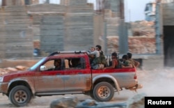 Fighters from Jabhat Fateh al-Sham in southwestern Aleppo on August 5