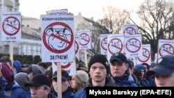 Ukrainian nationalists protest during a Poroshenko campaign rally in Lviv on March 28.