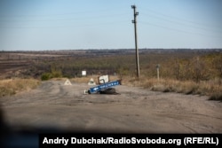 The front line in Hranitne. The hill in the background is controlled by Russia-backed separatists.