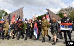 Night Wolves members and sympathizers take part in a provocative event commemorating Victory Day in World War II at a Soviet monument in Berlin in May 2017.