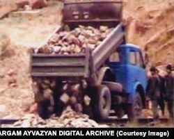 Chunks of broken khachkars being dumped during the 2005 demolition.