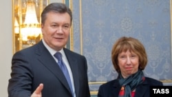 Ukrainian President Viktor Yanukovych (left) welcomes EU foreign-policy chief Catherine Ashton to Kyiv on December 10.