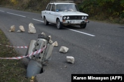 A Smerch embedded in a road near Shushi.