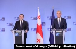 Georgian Prime Minister Irakli Garibashvili (left) and NATO Secretary-General Jens Stoltenberg