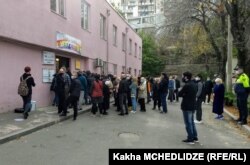 Georgians line up to vote in Tbilisi October 31.