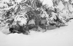 Dressed in white camouflage, the defenders were almost impossible to see among snow-dusted trees.