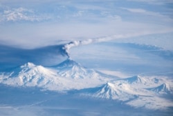 A shot of Klyuchevskoy erupting alongside other Kamchatka volcanoes as viewed from the International Space Station.