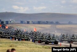 Chinese tanks roll about 250 kilometers southeast of the Russian city of Chita during the military exercises Vostok 2018 in September 2018.