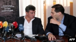 Russian opposition activists Boris Nemtsov (left) and Vladimir Milov in 2011.