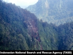 A view of the debris from a Russian Sukhoi Superjet 100 on the side of a dormant Indonesian volcano. The plane, with 45 people on board, disappeared from radar during a demonstration flight on May 9, 2012.